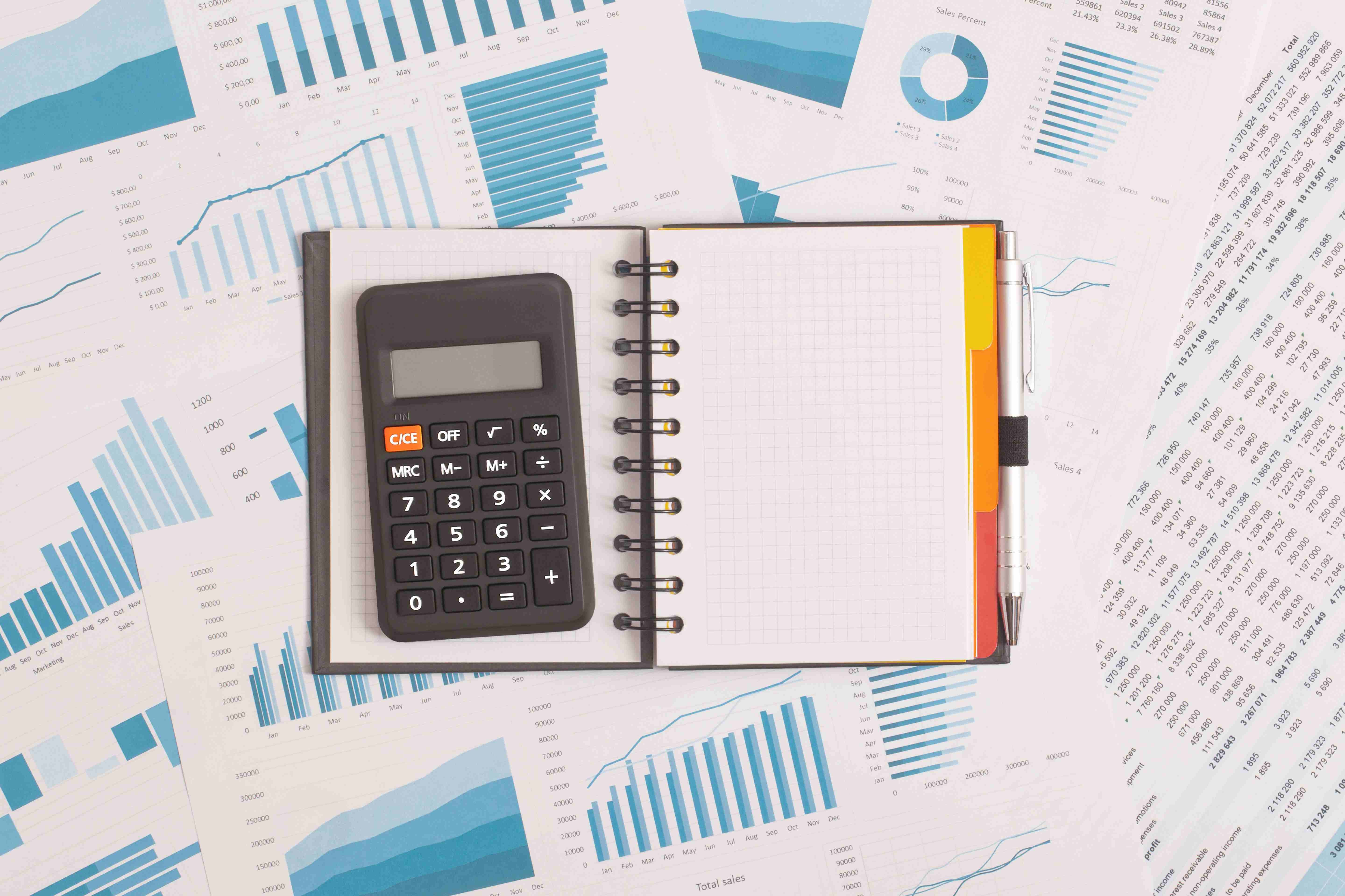 notebook-and-calculator-on-table-financial-develo-2026-01-07-01-34-50-utc
